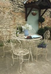 LARGE FRENCH CREAM METAL GARDEN TABLE AND FOUR MATCHING CHAIRS