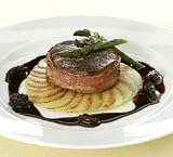 Bacon Wrapped Filet of Beef with Morel Reduction Served with Potatoes Anna