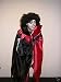 Tolles Outfit f�r einen gruseligen Auftritt. Im Lieferumfang enthalten ist ein  lila-schwarzer 
Umhang mit gro�em Kragen, eine schwarze Per�cke und ein Vampirgebiss.