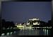 The City is Illuminated at Night Casting a Soft Glow onto the River, Salzburg, Austria Framed Art Poster Print by Taylor S. Kennedy, 55x38
