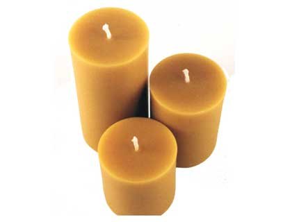 ArtisanStreet's Golden Pure Beeswax Pillar Candles. Set of three: 3 inch diameter, 4, 6 and 9 inches tall. Rich, honey-sweet aroma & burn with a warm glow. Hand Crafted, Limited Edition.