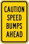 Caution Speed Bumps Ahead Sign - 12x18 - Black on Yellow Warning Sign