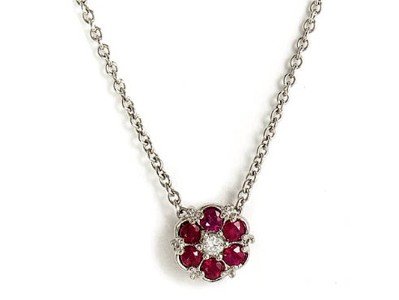 14K White Gold 7MM Flower Pendant Enhanced with Ruby and Prong Set Diamonds on a 16'' Cable Chain.