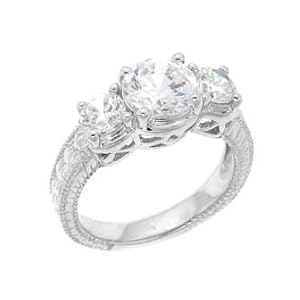 Sterling Silver Engagement Ring With Round Cubic Zirconia in a Four Prong Setting and Two Side Stones