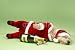 Wallmonkeys Peel and Stick Wall Decals - Small Dog in Santa Costume Lying down with Champagne Bottle