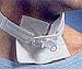 Replaces twill ties and provides comfortable, controlled support of tracheostomy tubes. A section of stretch material accomodates user's cough reflex or edema and assures precise tube positioning. Employs quick-fastening tabs for fast, easy, secure application to any tracheostomy tube. Single patient use. Latex-free. Fits most adults.