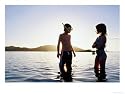 Children Standing in Water at Sunset, Playa Panama, Costa Rica Photographic Poster Print by Philip Smith, 16x12