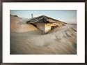 Sand swallows up an abandoned home on Cumberland Island Photography Framed Art Poster Print by Jodi Cobb, 29x21