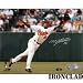 Miguel Tejada Autographed/Hand Signed Baltimore Orioles 8x10 Photo (Stretching for Ball)