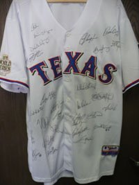 Signed Rangers, Texas (2011) Authentic 2011 World Series Jersey By The 2011 Texas Rangers Team and including Nolan Ryan. 27 signatures in all