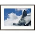 The Karakoram Ranges Fathi Tower rises through the clouds Photography Framed Art Poster Print by Jimmy Chin, 29x21