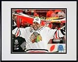 Dustin Byfuglien with Chicago Blackhawks Flag 2010 Stanley Cup Finals (#35) Double Matted 8" x 10" Photograph in Black Anodized Aluminum Frame