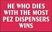 HE WHO DIES WITH THE MOST PEZ DISPENSERS WINS T-Shirt (Various Colors Available) Image