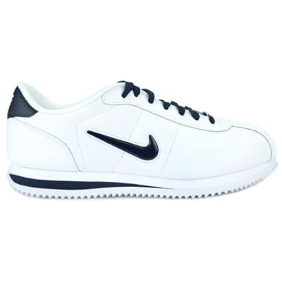 white nike cortez with navy blue swoosh