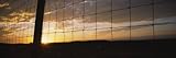 Sunset Viewed Through a Fence, North Dakota, USA Landscape Photographic Poster Print by Panoramic Images , 20x60
