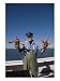 A Man Holds up Two Big Lobsters Photographic Poster Print by Taylor S. Kennedy, 18x24