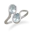Blue Topaz Ring with Wavy Band Design
