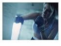 Female Boxer Punching a Punching Bag Photographic Poster Print, 24x18