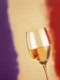 A Glass of White Wine in Front of the French Flag Premium Photographic Poster Print by Steven Morris, 18x24