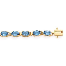 14K Oval Blue Topaz Bracelet 22-6x4mm, 7 by A Great Jewelry Co.