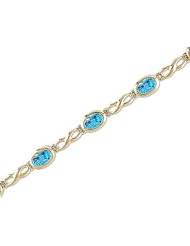 14kt Yellow Gold Oval Blue Topaz Bracelet.