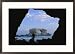 A man silhouetted against La Portada rock arch on the coast of Chile Photography Framed Art Poster Print by Joel Sartore, 29x21