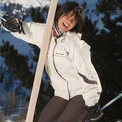 Happy woman on ski slope laughing wearing ladies Foxe Ortford Ski Jacket