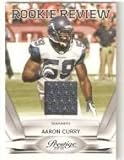 2010 Prestige Rookie Review Materials #18 Aaron Curry - Seattle Seahawks (RC - Rookie Card - Piece of Authentic Jersey ) (Football Cards)