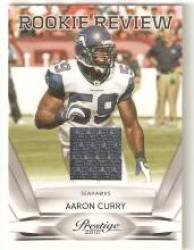 2010 Prestige Rookie Review Materials #18 Aaron Curry - Seattle Seahawks (RC - Rookie Card - Piece of Authentic Jersey ) (Football Cards)