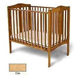 Angel Line Foldable Mini Crib Finish: Oak