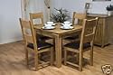 Extending Solid Oak Dining/Kitchen Table with Four Oak and Faux Leather Chairs