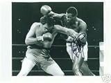 LARRY HOLMES AUTOGRAPHED BOXING PHOTO VS TEX COBB LAST 15RD FIGHT (BOXING)