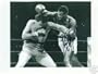 LARRY HOLMES AUTOGRAPHED BOXING PHOTO VS TEX COBB LAST 15RD FIGHT (BOXING)