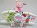 Celebrate the birth or annoucement of a new baby girl with our New Arrival Gift Plane. The plane comes adorned with colorful and useful items to welcome in the birth of a baby.