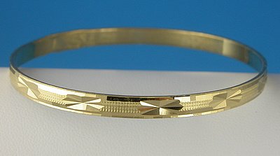 Click here to buy 18K Gold Filled Womens Diamond-Cut Bangle Bracelet - X-Small.
