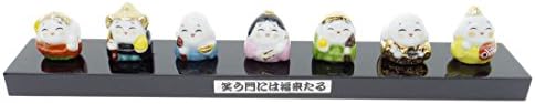 Japanese Handmade Seven Lucky Gods of Fortune Deities Shichifukujin Ceramic Buddha Feng Shui Mini Figurine fixed on a Black Lacquer Wooden Base Japan Import Made in Japan