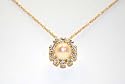 14k Yellow Gold 18" Chain With 10 Stone 8mm White Cubic Zirconia Circle With a 5mm Freshwater Cultured Pearl In the Center