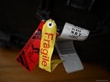 A Fragile Tag is Shown Hanging on a Piece of Baggage Artists Photographic Poster Print, 18x24
