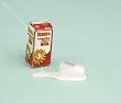 Miniature Carton of Milk with a Spilled Glass of Milk