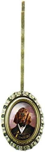 Scalloped hairpin with oval glass cabochon protecting a design with a dog dressed up an army general