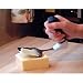 Easi-Grip Kitchen Cheese Slicer The Easi-Grip Kitchen Cheese Slicer has an ergonomically angled handle that keeps wrist in a natural position and is ideal for those with particularly weak hands and wrists. Plastic handle has a soft-feel non-slip finish that provide a comfortable grip even when hand is wet or greasy. Utensil is stainless steel and dishwasher safe. Supplied with protective film. Overall length is 6.9" - Weight is 4.9 oz. HOW TO USE: Holding the black soft-feel non-slip handle use the utensil as normal. Key Features of the Easi-Grip Kitchen Cheese Slicer: Plastic handle has a soft-feel non-slip finish Angled handle keeps wrist in neutral position Overall length - 6.9 in. Ultra lightweight - 4.9 oz. Stainless steel utensil Dishwasher safe 2 year guarantee Easi-Grip Kitchen Group All seven of the Easi-Grip kitchen utensils feature the comfortable, non-slip, ergonomically angled handle. Spatula Cheese Slicer Grater Carving Fork Carving Knife Forked Knife Bread Knife Utility Scissors Magnetic Holder