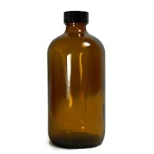 Qorpak Amber Glass Boston Round Bottle with Black Phenolic Polyseal Cone Lined Cap