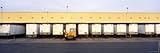 IMAGE OF Vehicle Trailers in a Row Parked at a Terminal, Barstow, California, USA Stretched Canvas Poster Print by Panoramic Images , 14x42
