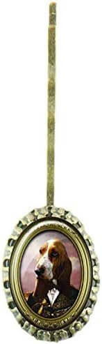 Scalloped hairpin with oval glass cabochon protecting a design with a dog dressed up an army general