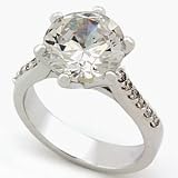 Engagement style ring, made with AAA grade imitation diamond (Cubic Zirconia) and high quality Rhodium plating. Main stone approximate 5.5 carat.