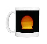 Image of a distorted Sun seen at sunset Photo Mugs