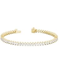 14KT Yellow Gold Beautiful Diamond Tennis Bracelet featuring 59 Round Brilliant Cut Diamonds set into a Double Prong High Polished Setting. 5 3/4 CTW