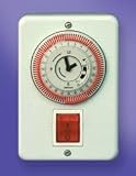 Shabbat clock for sun-heated water tank on the wall