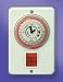 Shabbat clock for sun-heated water tank on the wall