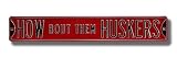 NEBRASKA CORNHUSKERS HOW BOUT THEM HUSKERS AUTHENTIC METAL STREET SIGN (6 X 36)